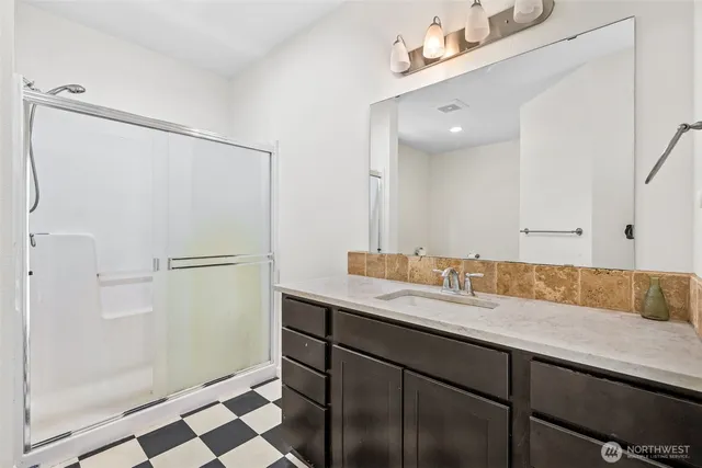 a bathroom with a sink and a mirror