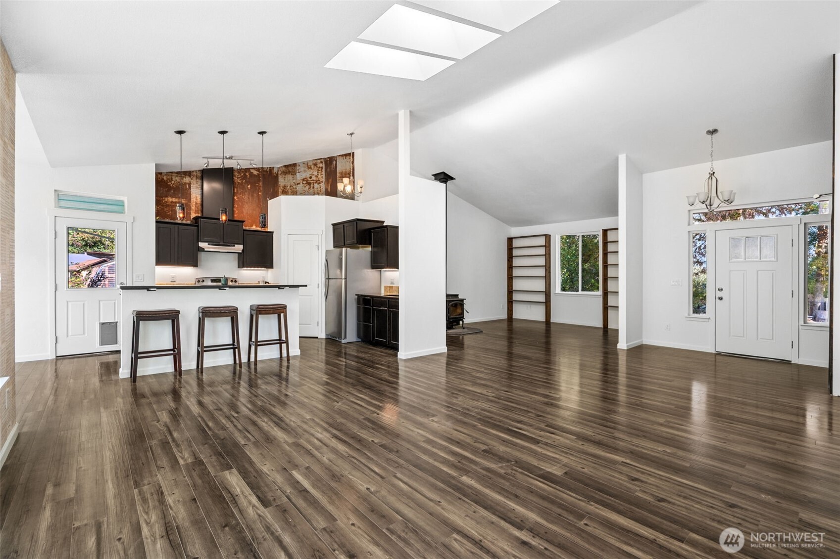 662 Cline Road Randle, WA 98377 - Photo 6 of 36 a living room with furniture wooden floor and a kitchen view