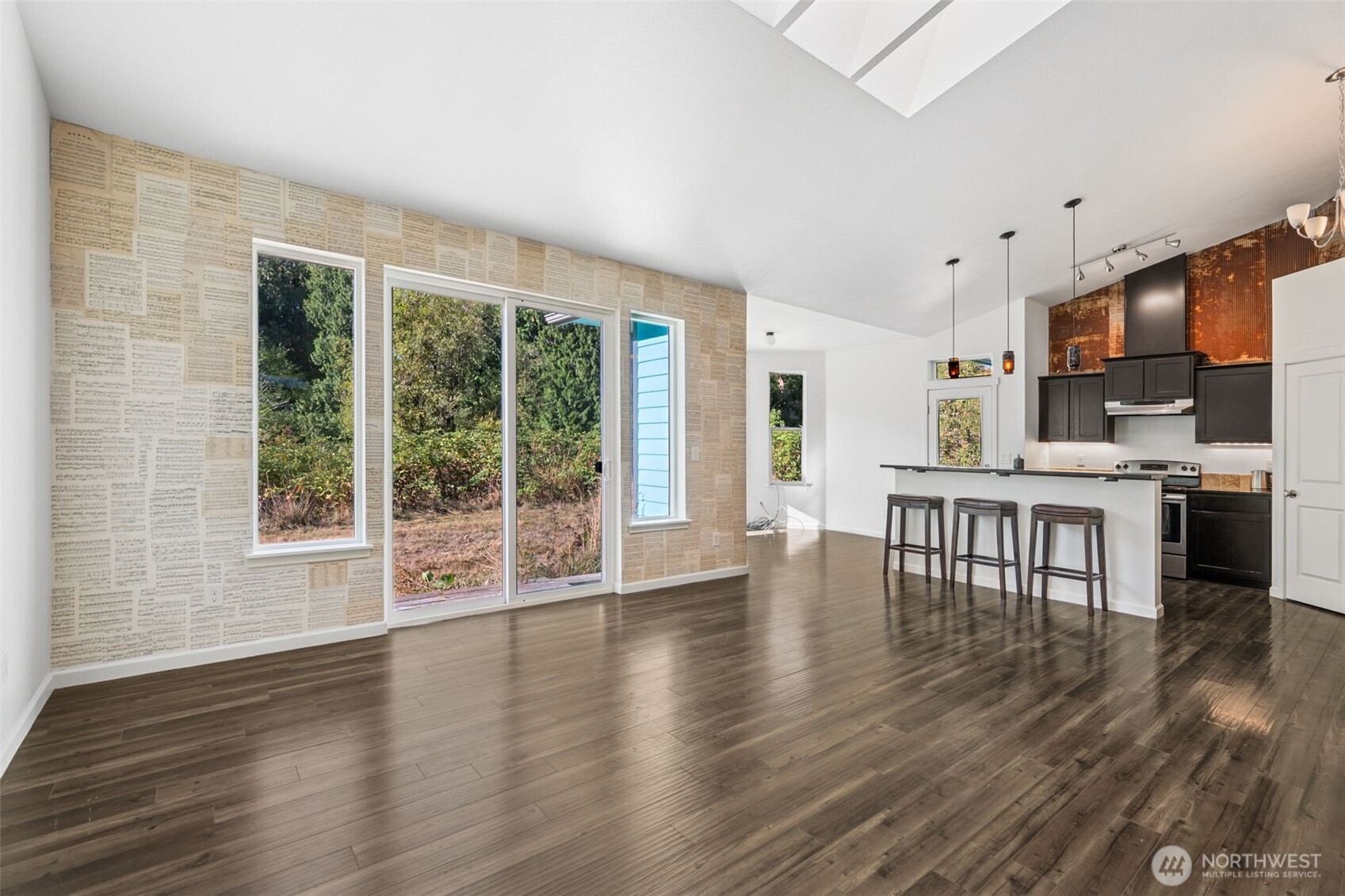 662 Cline Road Randle, WA 98377 - Photo 9 of 36 a dining room with furniture floor to ceiling window and wooden floor