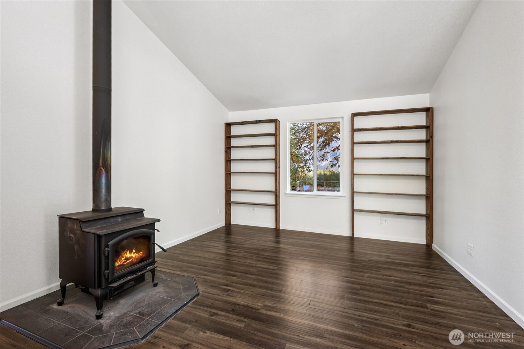 662 Cline Road Randle, WA 98377 - Photo 10 of 36 wooden floor in an empty room with a fireplace
