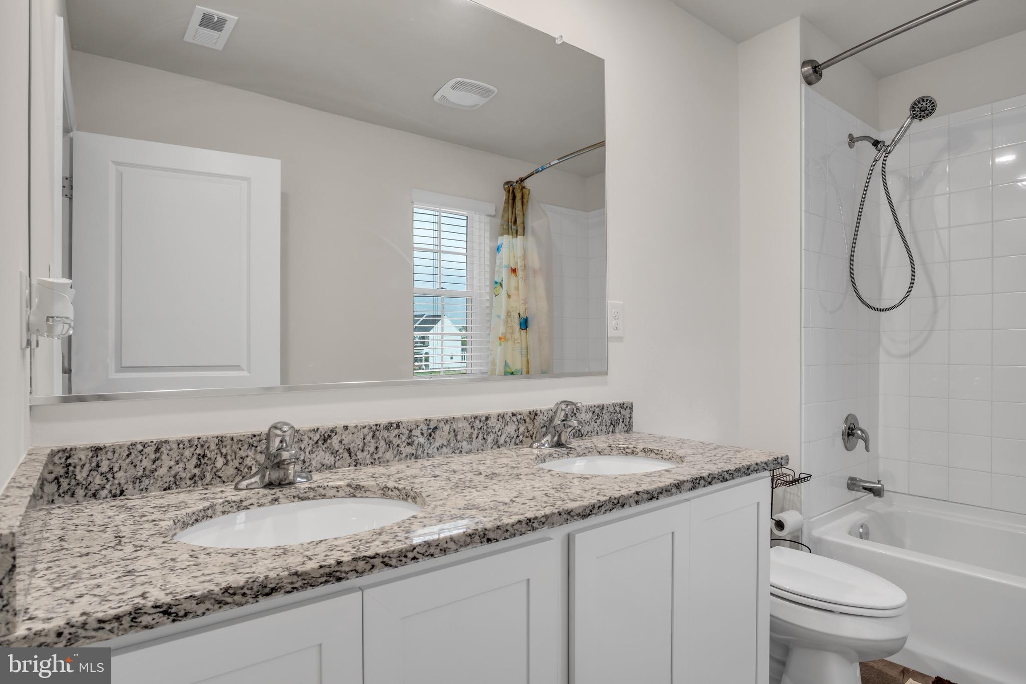 18 Smokehouse Road Carlisle, PA 17013 - Photo 28 of 33 a bathroom with a granite countertop sink and a mirror