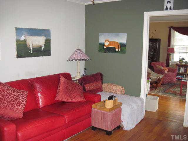 2135 Milburnie Road Raleigh, NC 27610 - Photo 11 of 17 a living room with furniture and a flat screen tv