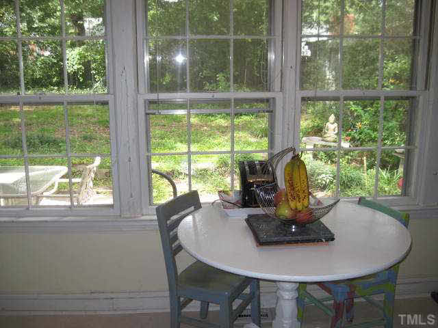 2135 Milburnie Road Raleigh, NC 27610 - Photo 7 of 17 a dining room with a window and table