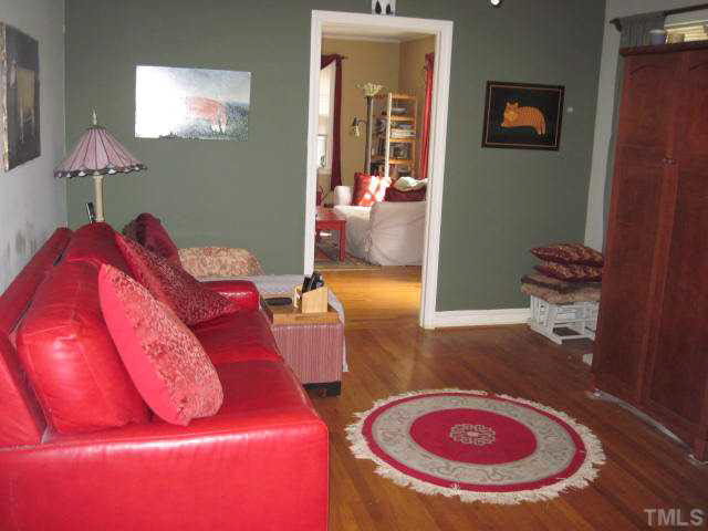 2135 Milburnie Road Raleigh, NC 27610 - Photo 9 of 17 a living room with furniture and a chandelier