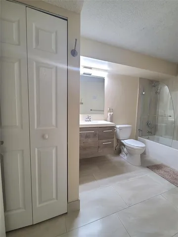 a bathroom with a toilet sink and a bathtub