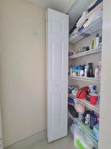 a room with lots of different colored cloths