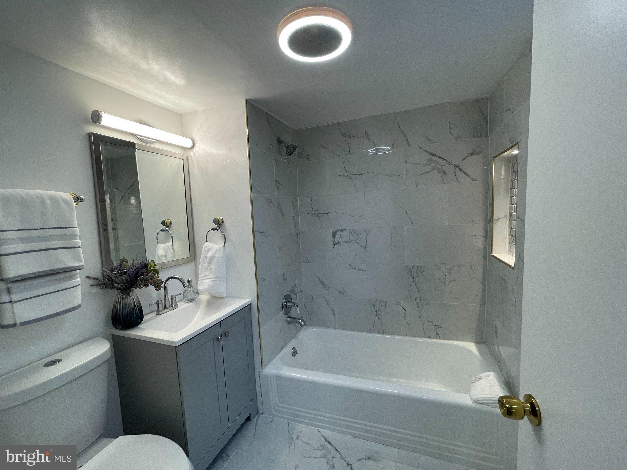 3712 West Cold Spring Lane Baltimore, MD 21215 - Photo 13 of 39 Modern elegance in a serene bathroom.
