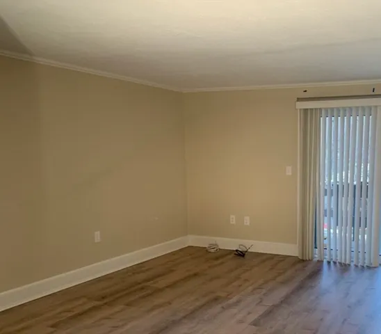 a bathroom with a shower a sink and a toilet