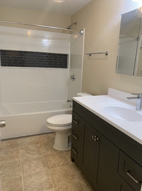 10 Mill Street, Unit X Maynard, MA 01754 - Photo 17 of 17 a bathroom with a sink a toilet and shower