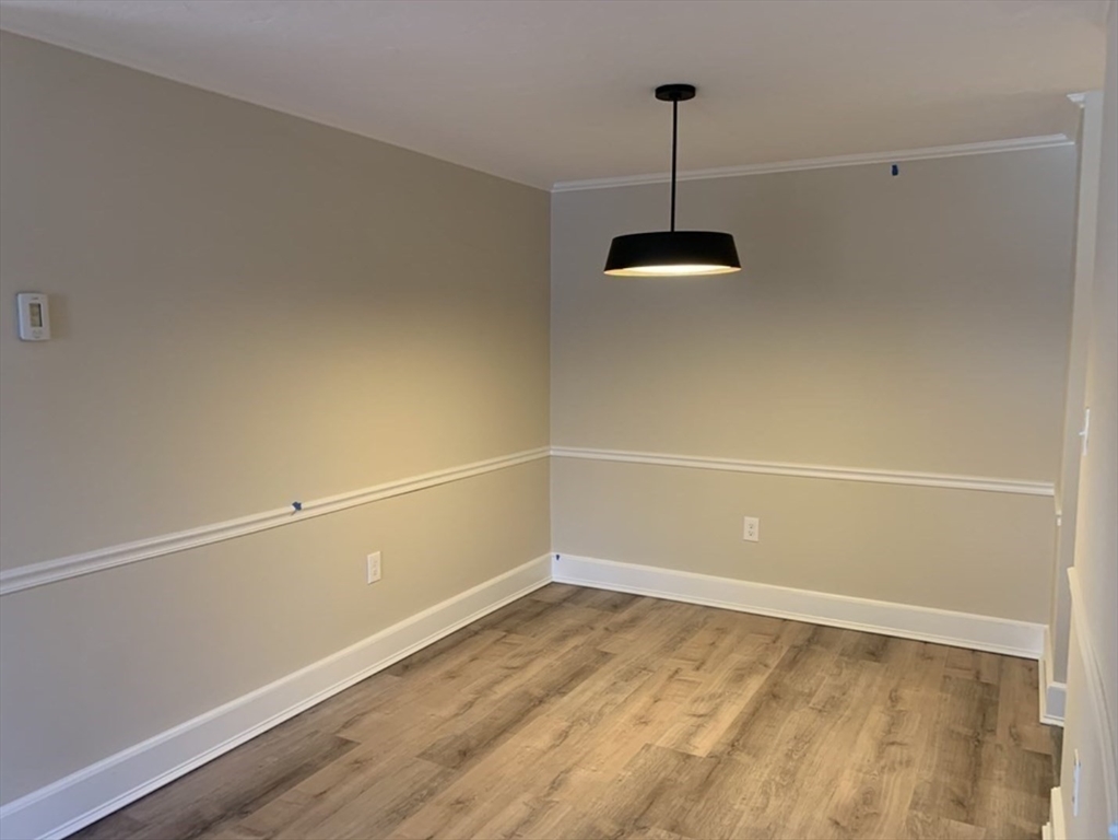 10 Mill Street, Unit X Maynard, MA 01754 - Photo 8 of 17 a view of a room with wooden floor