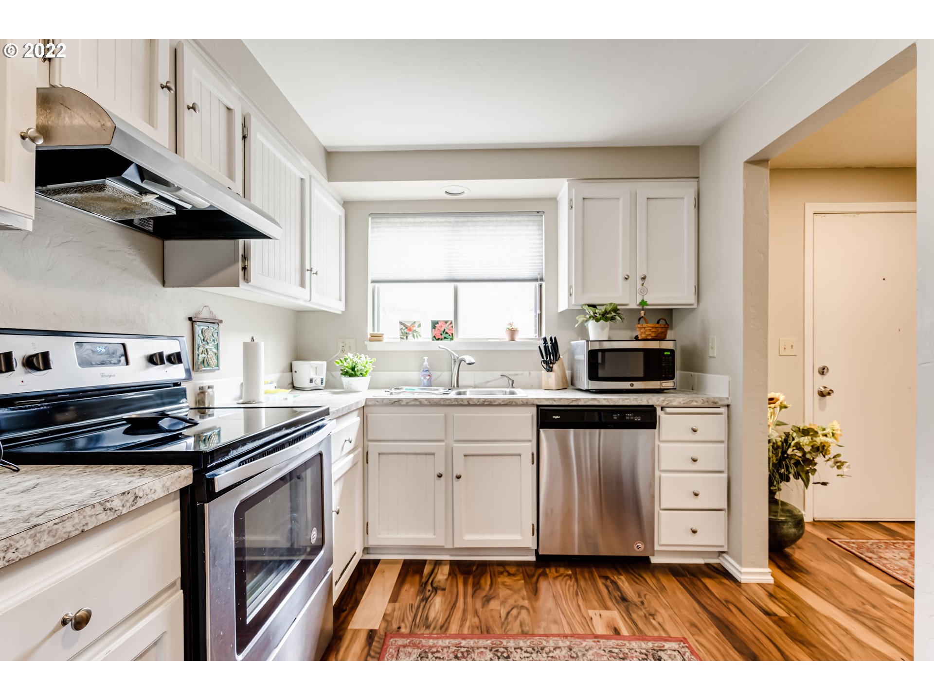2220 Ridgeway Drive Eugene, OR 97401 - Photo 5 of 32 a kitchen with a sink a stove and cabinets