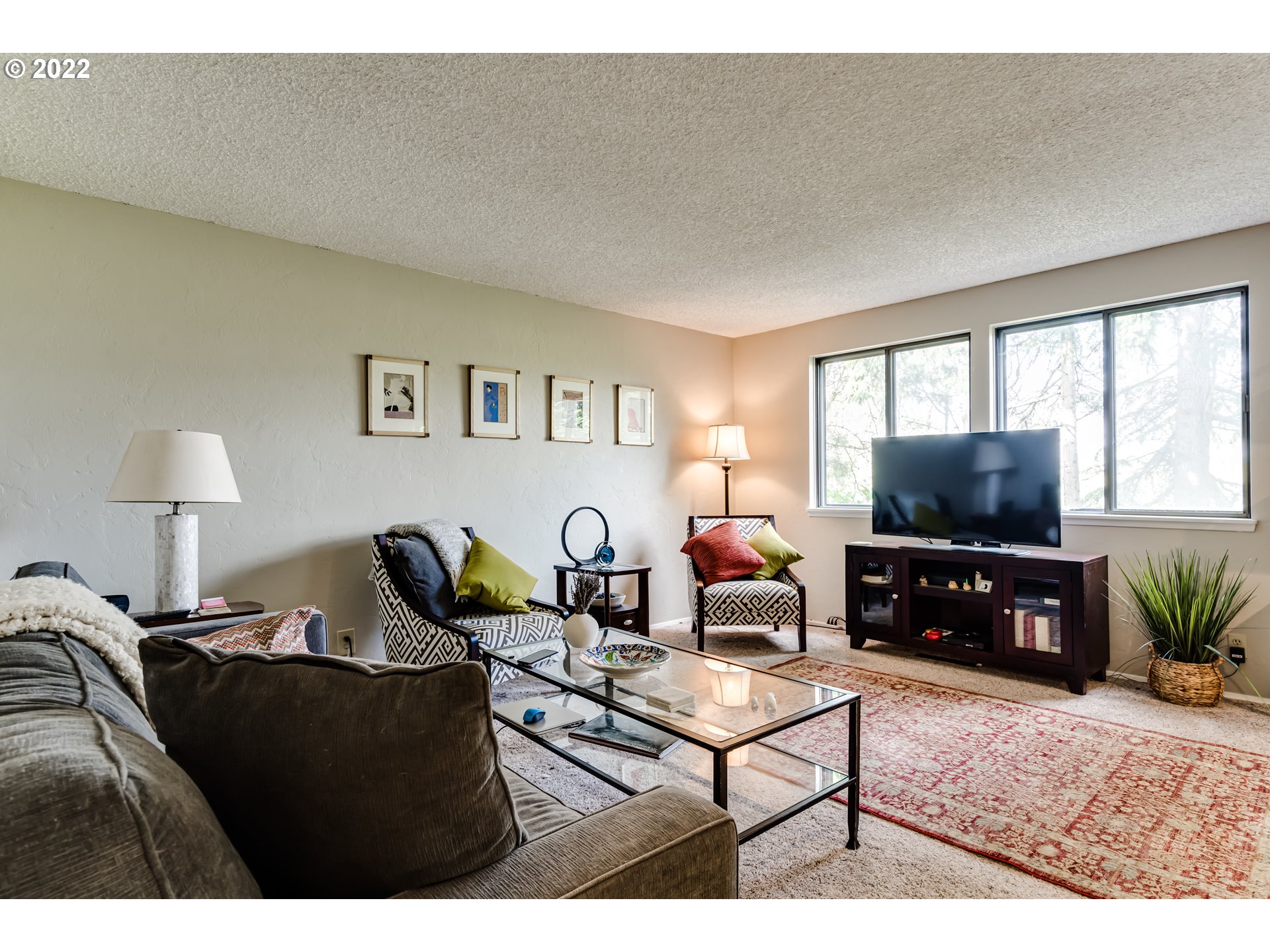 2220 Ridgeway Drive Eugene, OR 97401 - Photo 10 of 32 a living room with furniture and a flat screen tv