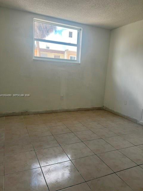 666 West 81st Street, Unit 103 Hialeah, FL 33014 - Photo 12 of 12 a view of a room that has a window in it