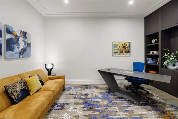 a view of a workspace with furniture