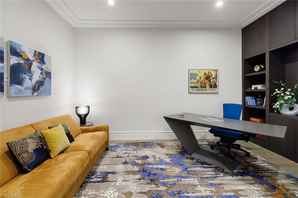 495 5th Street South, Unit 304 Naples, FL 34102 - Photo 19 of 33 a living room with furniture and wooden floor