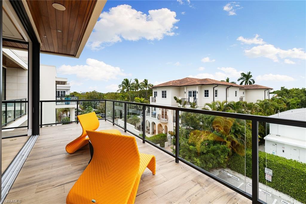 495 5th Street South, Unit 304 Naples, FL 34102 - Photo 31 of 33 a view of a balcony with chairs
