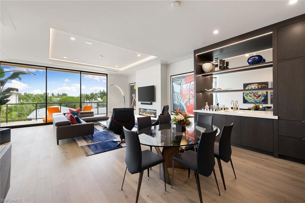 495 5th Street South, Unit 304 Naples, FL 34102 - Photo 7 of 33 a view of a dining room with furniture window and outside view