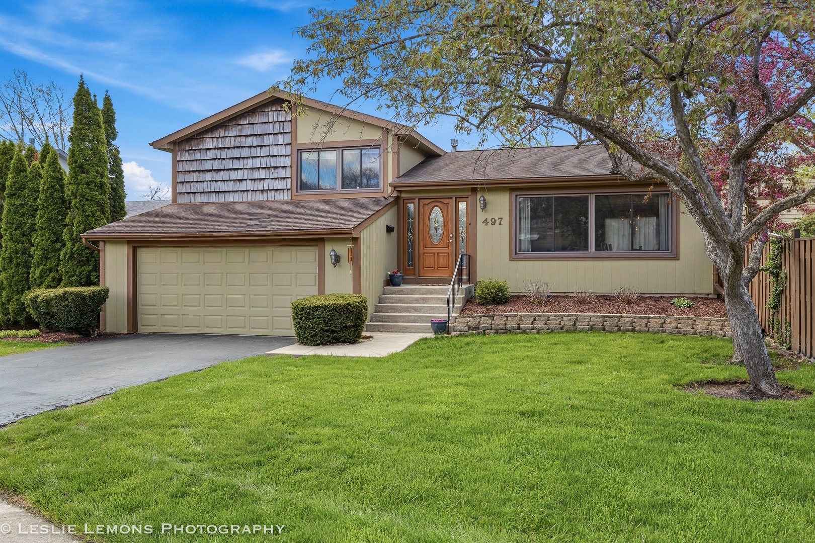 497 Sequoia Trail Roselle, IL 60172 - Photo 1 of 21 a front view of a house with a yard and trees