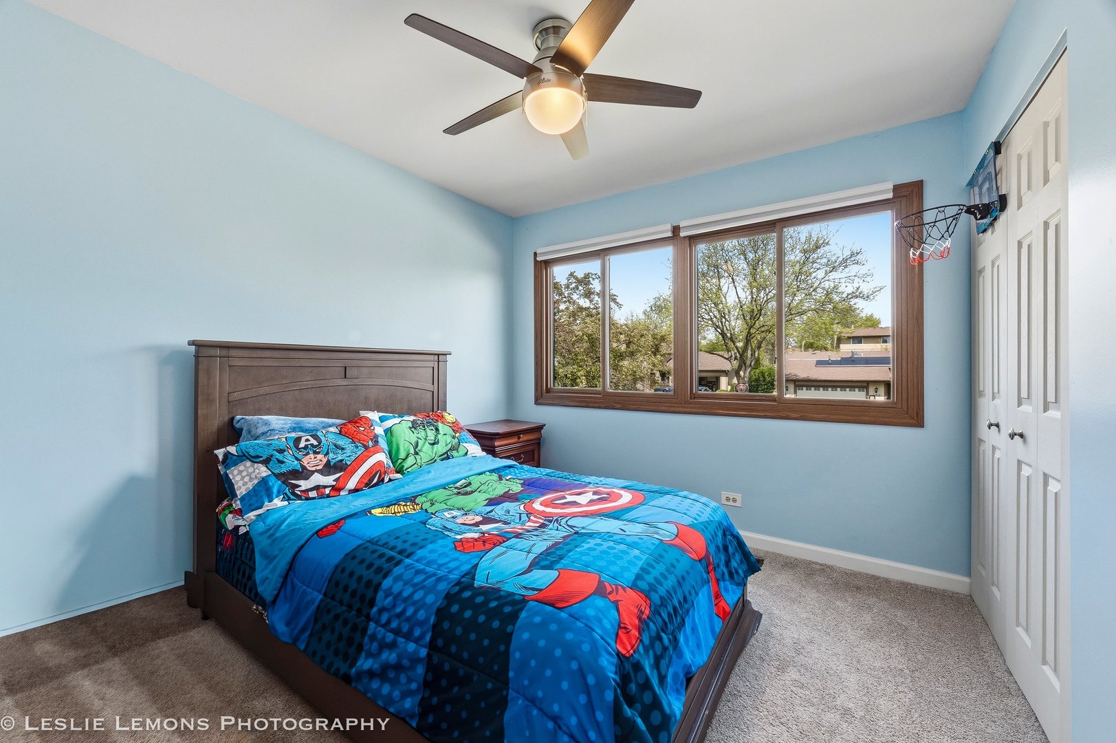 497 Sequoia Trail Roselle, IL 60172 - Photo 16 of 21 a bedroom with a bed a window and a chandelier