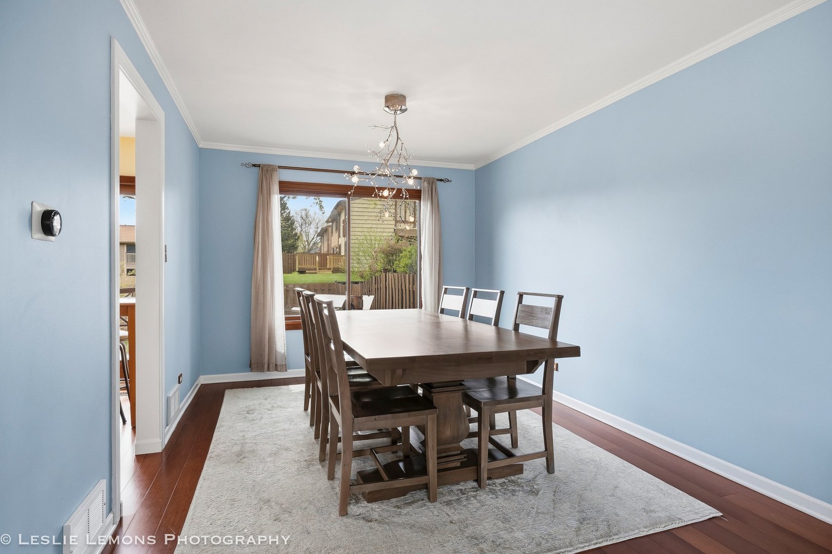 497 Sequoia Trail Roselle, IL 60172 - Photo 7 of 21 a view of a dining room with furniture window and wooden floor