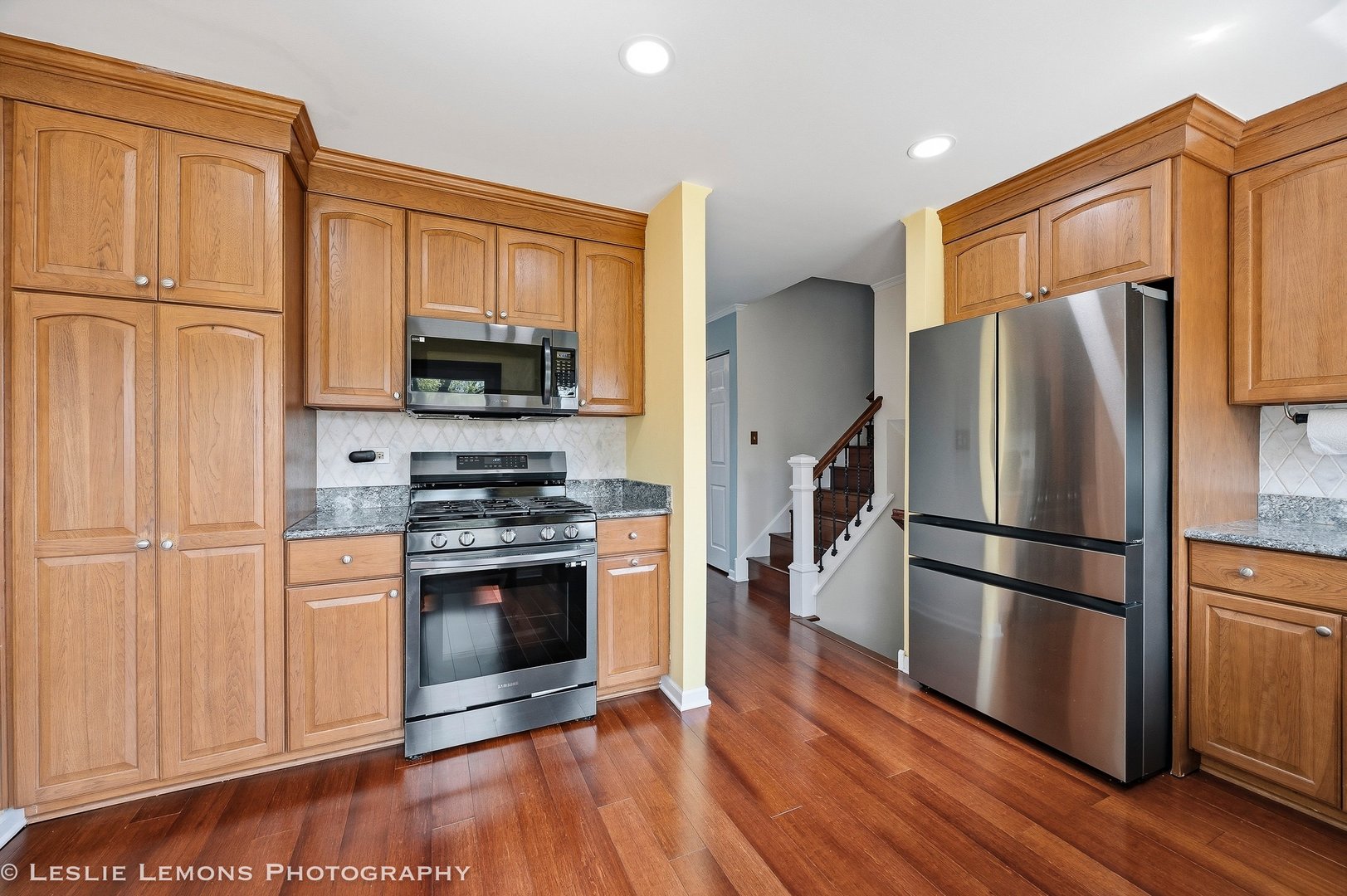 497 Sequoia Trail Roselle, IL 60172 - Photo 8 of 21 a kitchen with stainless steel appliances a refrigerator stove and microwave