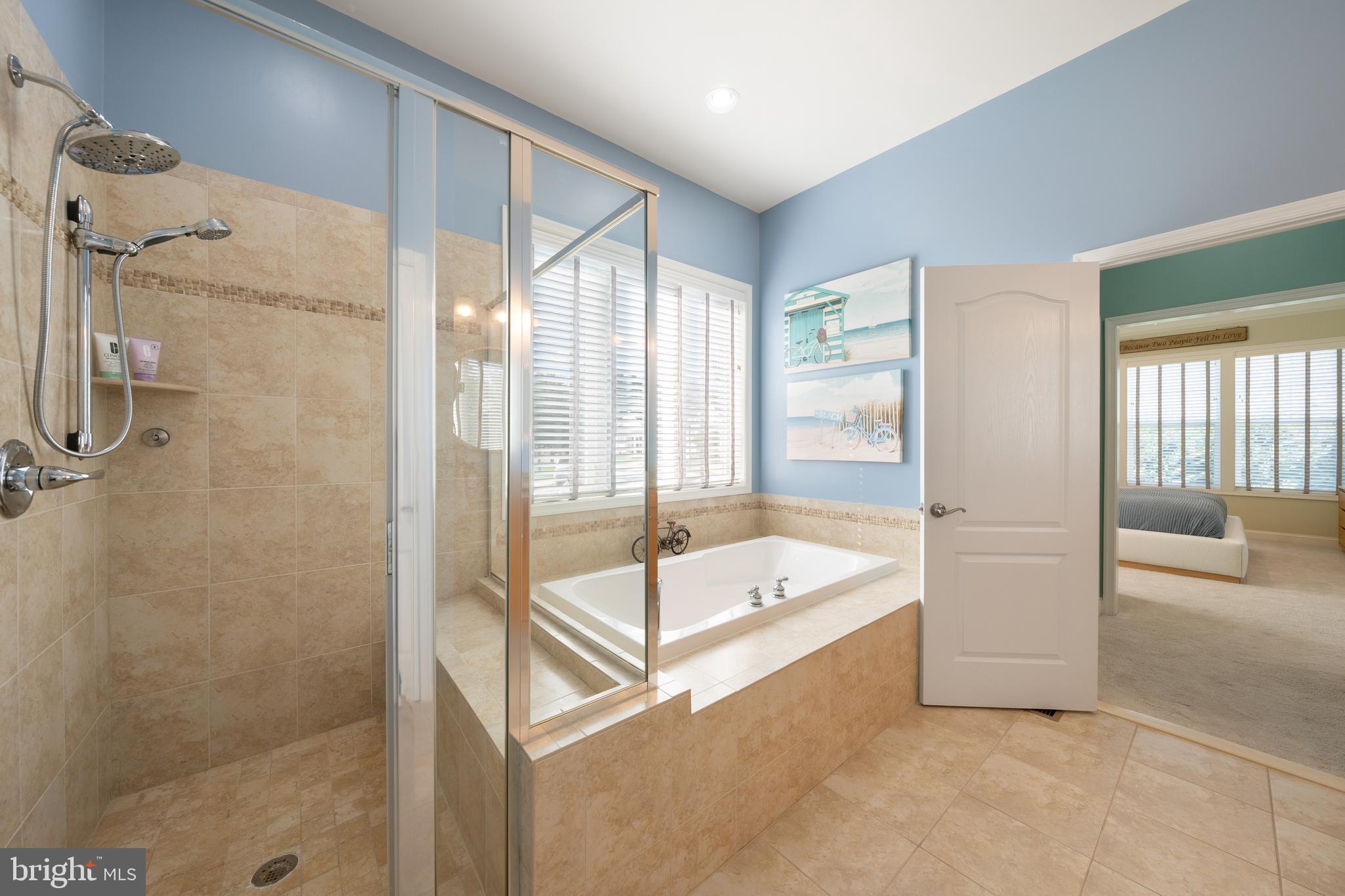 400 Shipyard Way Solomons, MD 20688 - Photo 19 of 100 a bathroom with a tub and a shower