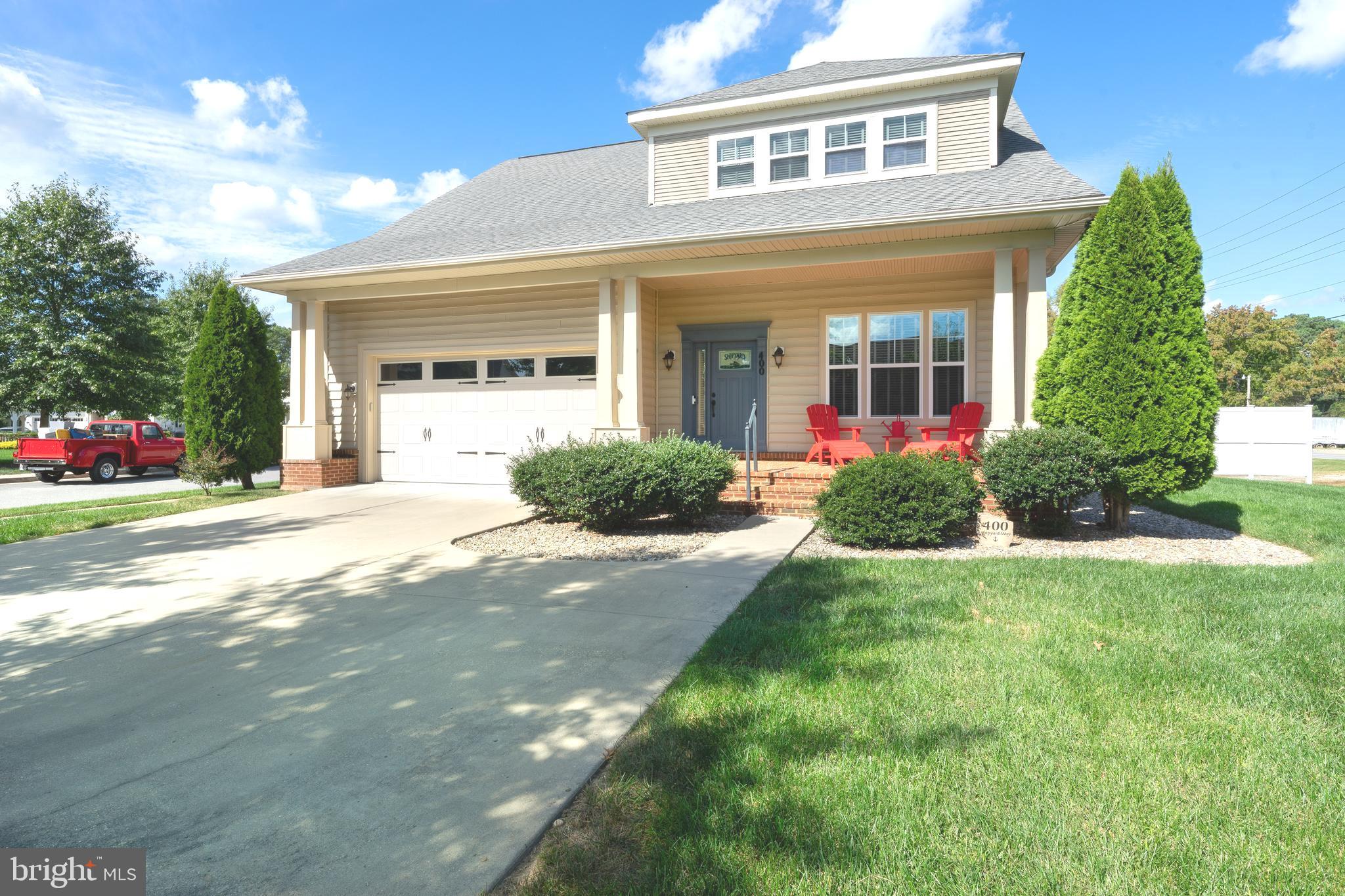 400 Shipyard Way Solomons, MD 20688 - Photo 5 of 100 a front view of a house with a yard