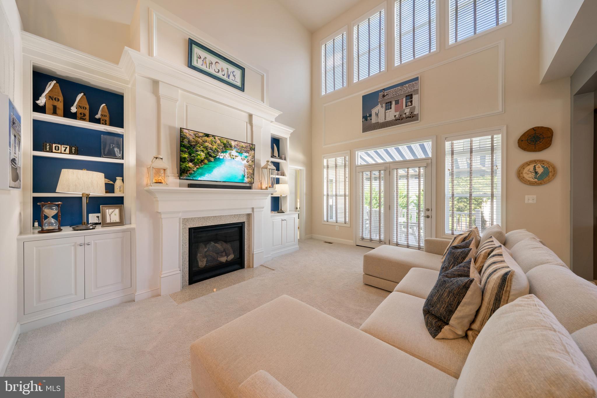 400 Shipyard Way Solomons, MD 20688 - Photo 6 of 100 a living room with furniture a fireplace and a flat screen tv