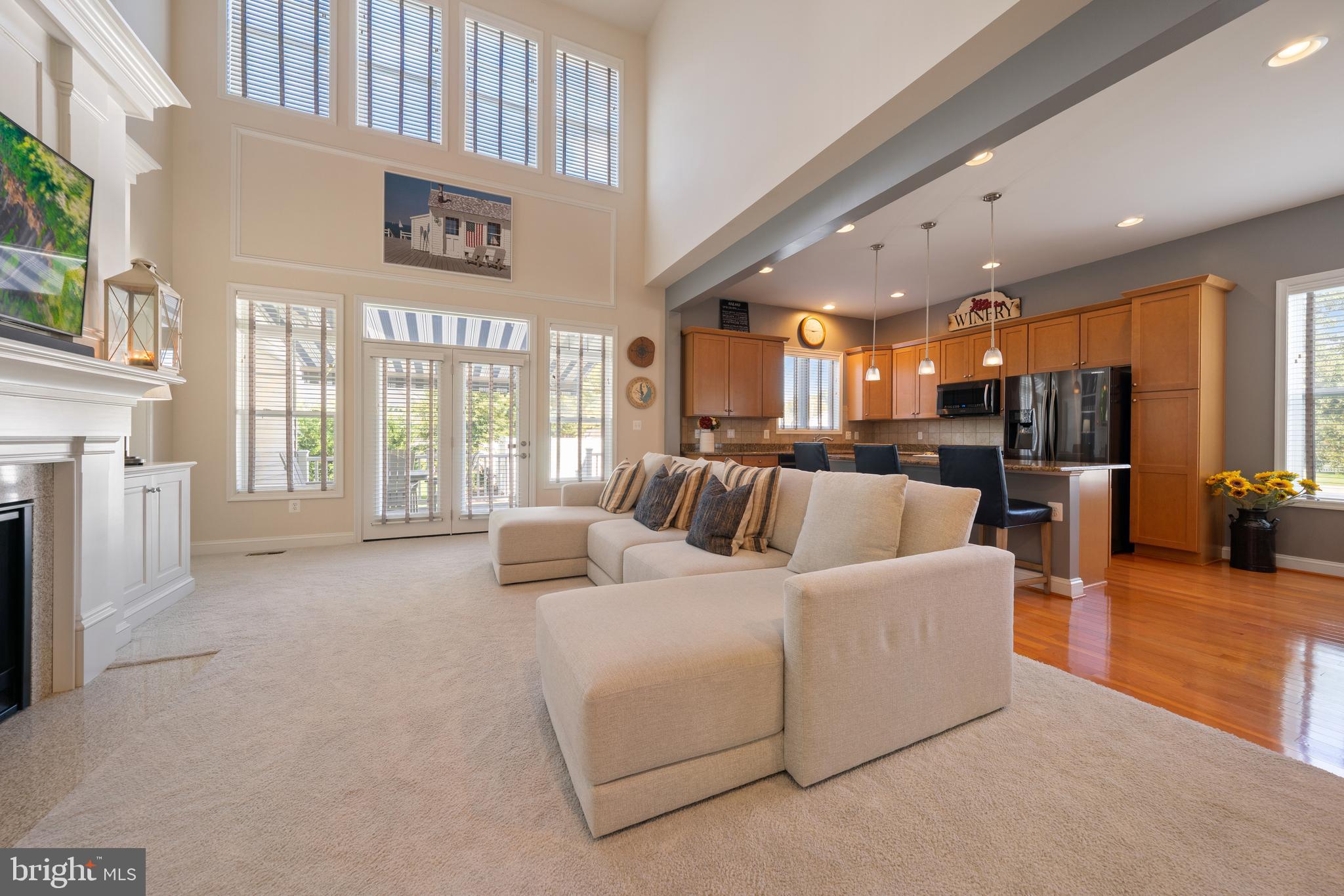 400 Shipyard Way Solomons, MD 20688 - Photo 7 of 100 a living room with furniture and a large window