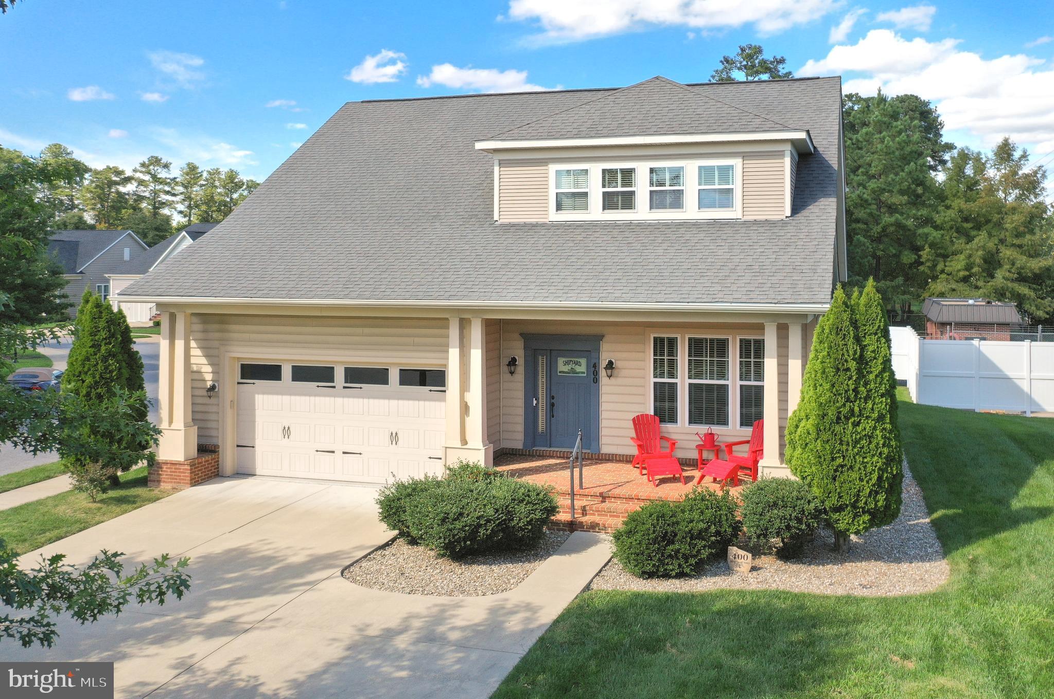 400 Shipyard Way Solomons, MD 20688 - Photo 77 of 100 a front view of a house with garden