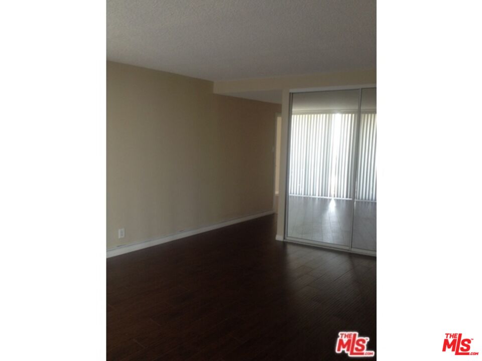 700 East Ocean Boulevard, Unit 1903 Long Beach, CA 90802 - Photo 8 of 9 a view of an empty room with wooden floor