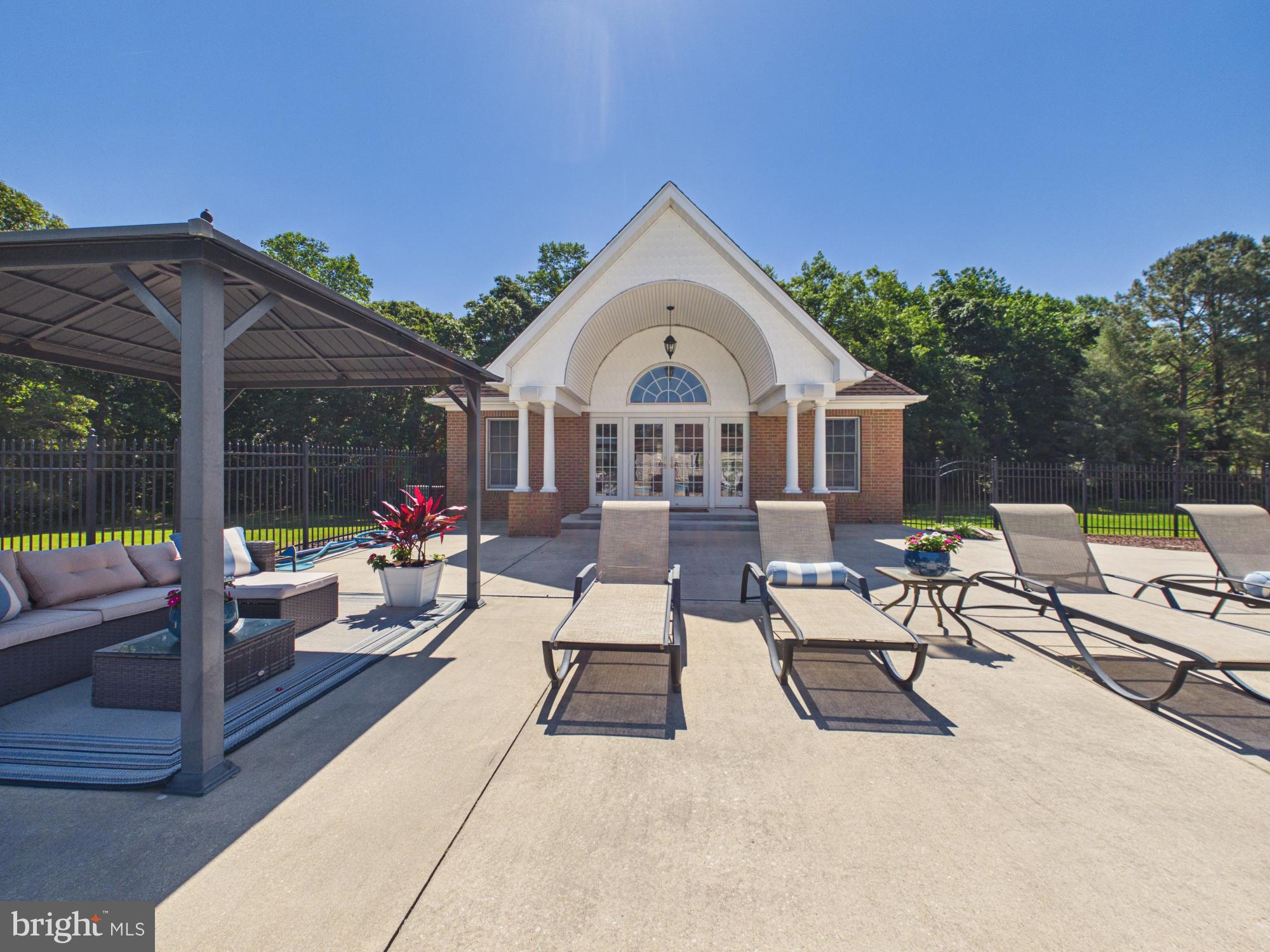 3298 Canterbury Road Milford, DE 19963 - Photo 49 of 74 Pool House Exterior & Covered Seating