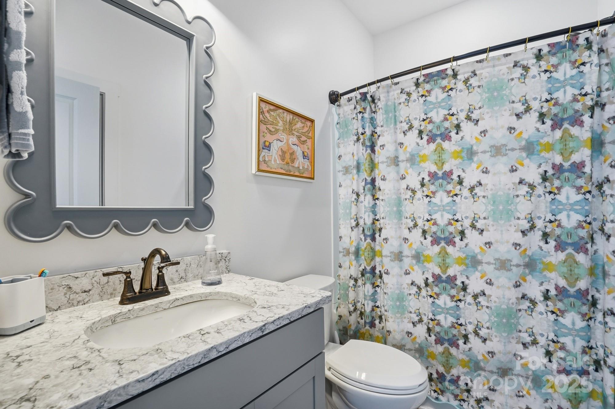 6246 Six String Court Fort Mill, SC 29708 - Photo 19 of 48 a bathroom with a granite countertop sink and a mirror