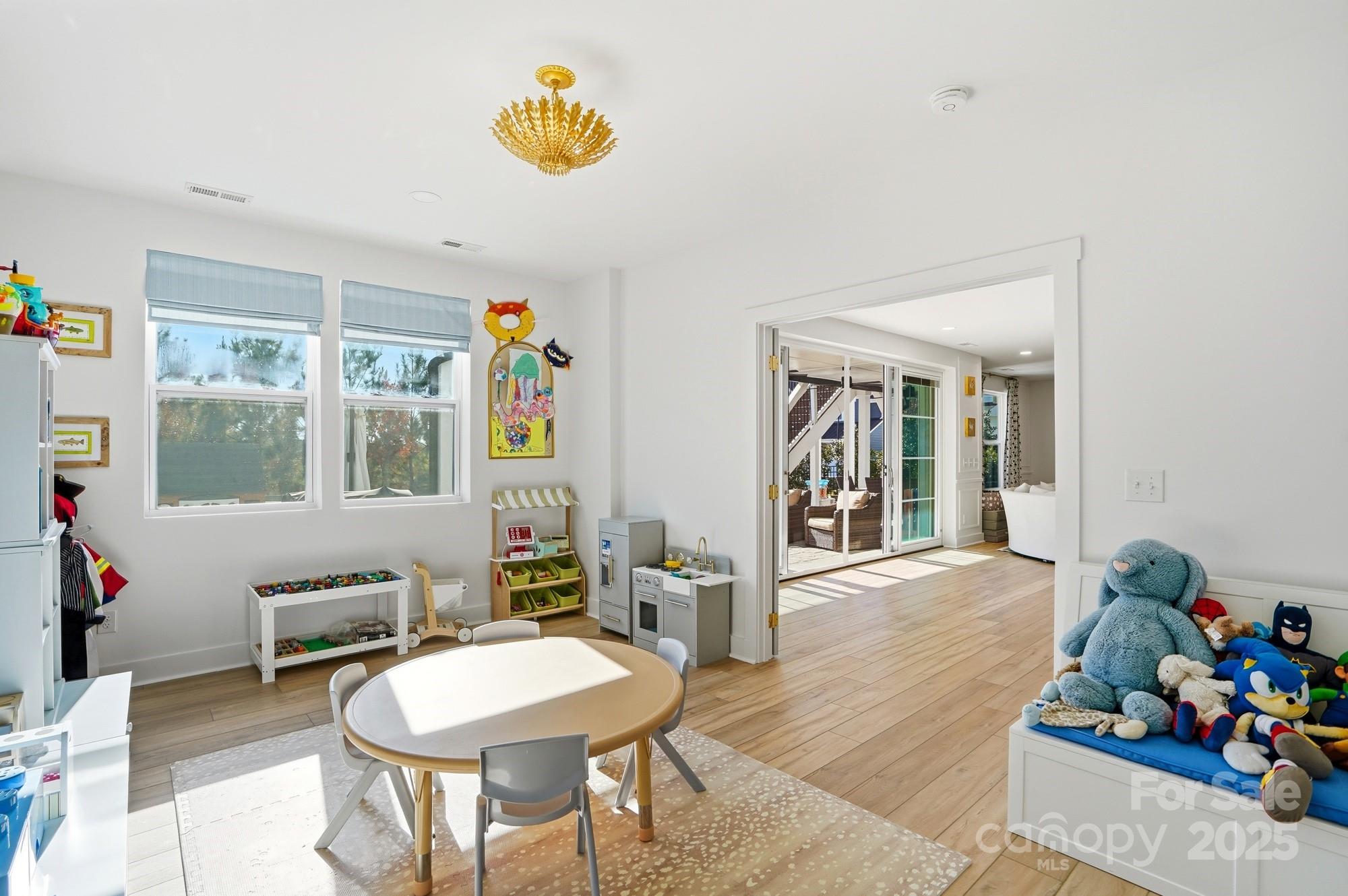 6246 Six String Court Fort Mill, SC 29708 - Photo 33 of 48 a view of a dining room with furniture window and wooden floor