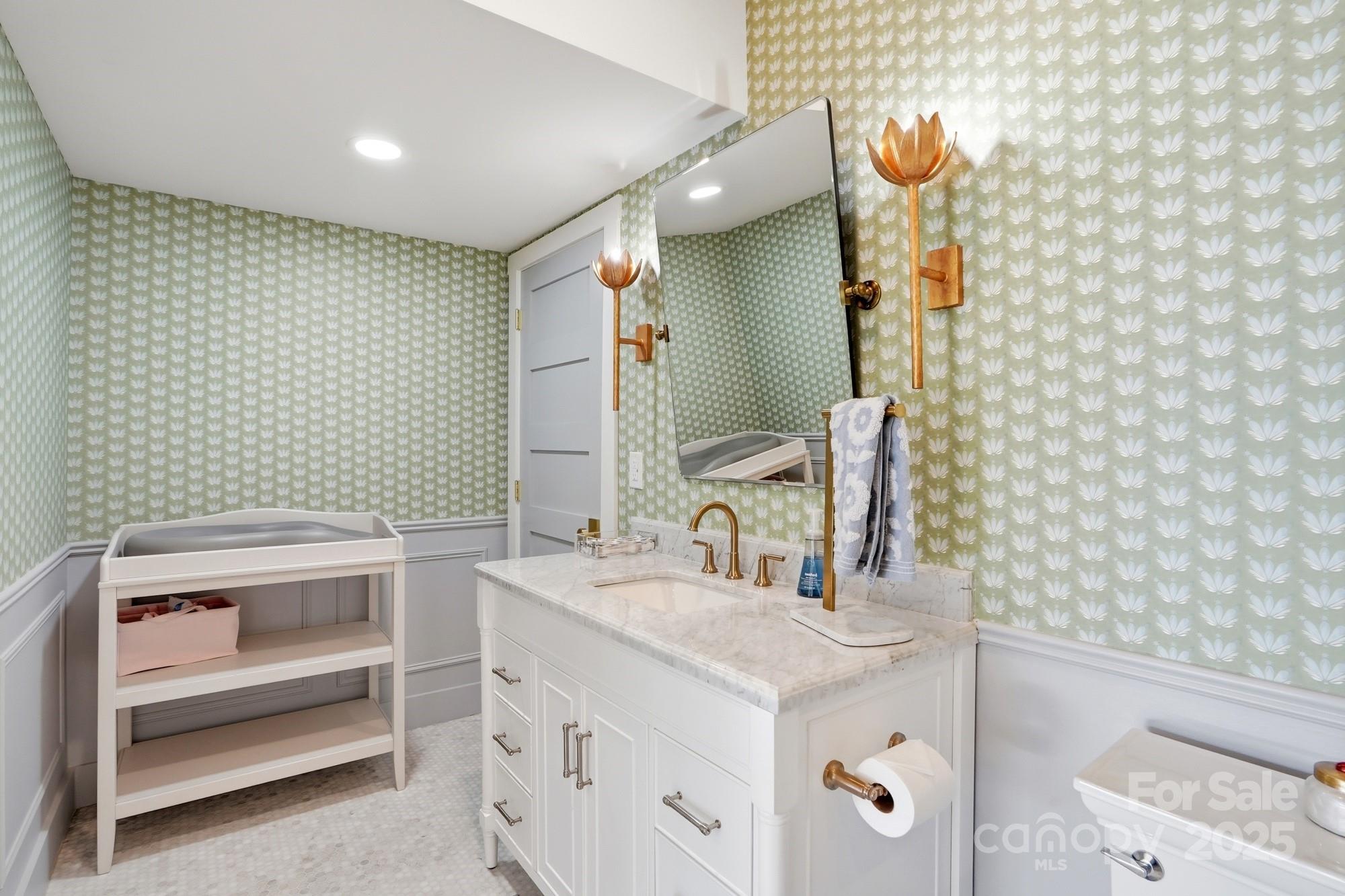 6246 Six String Court Fort Mill, SC 29708 - Photo 35 of 48 a bathroom with a sink a toilet and mirror