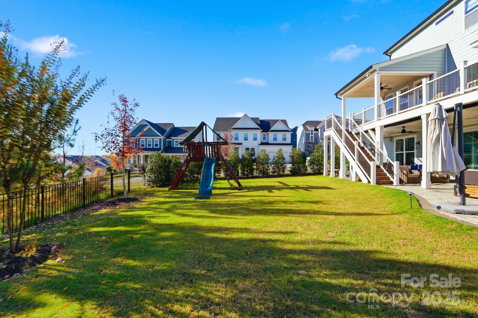 6246 Six String Court Fort Mill, SC 29708 - Photo 39 of 48 a view of a house with a big yard and potted plants