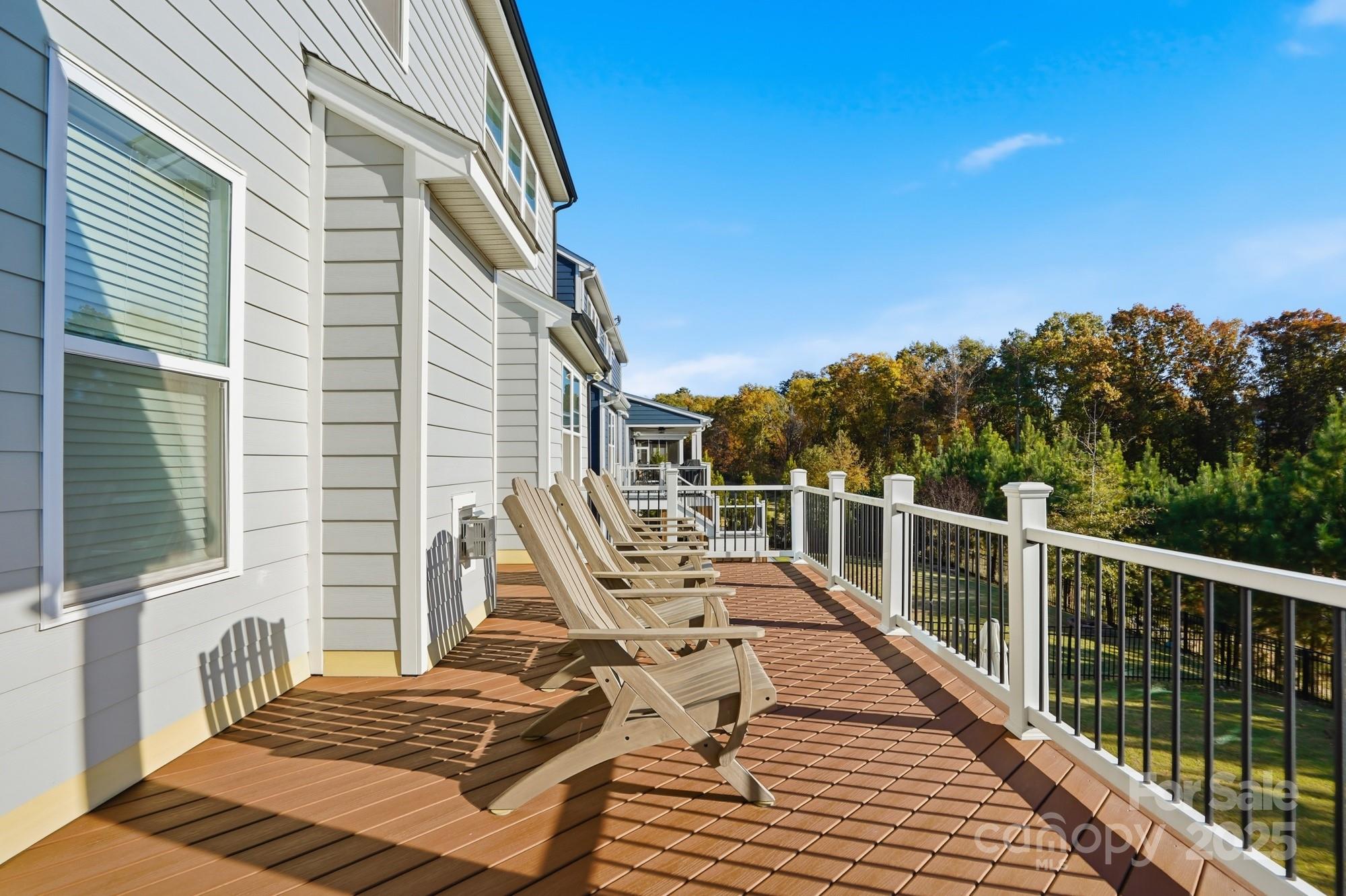 6246 Six String Court Fort Mill, SC 29708 - Photo 44 of 48 a view of a balcony with two chairs and wooden floor