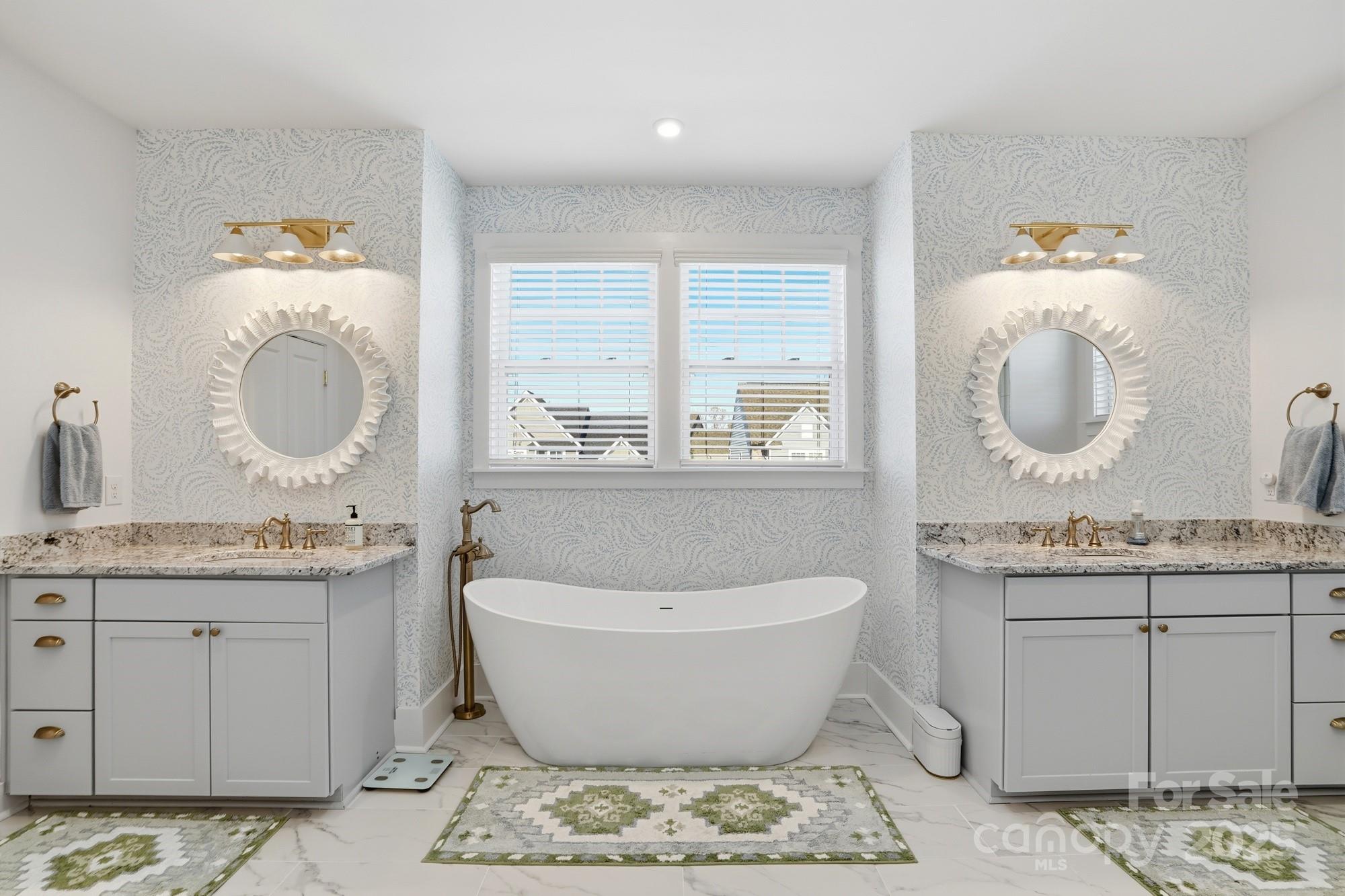 6246 Six String Court Fort Mill, SC 29708 - Photo 5 of 48 a spacious bathroom with a granite countertop sink and a mirror