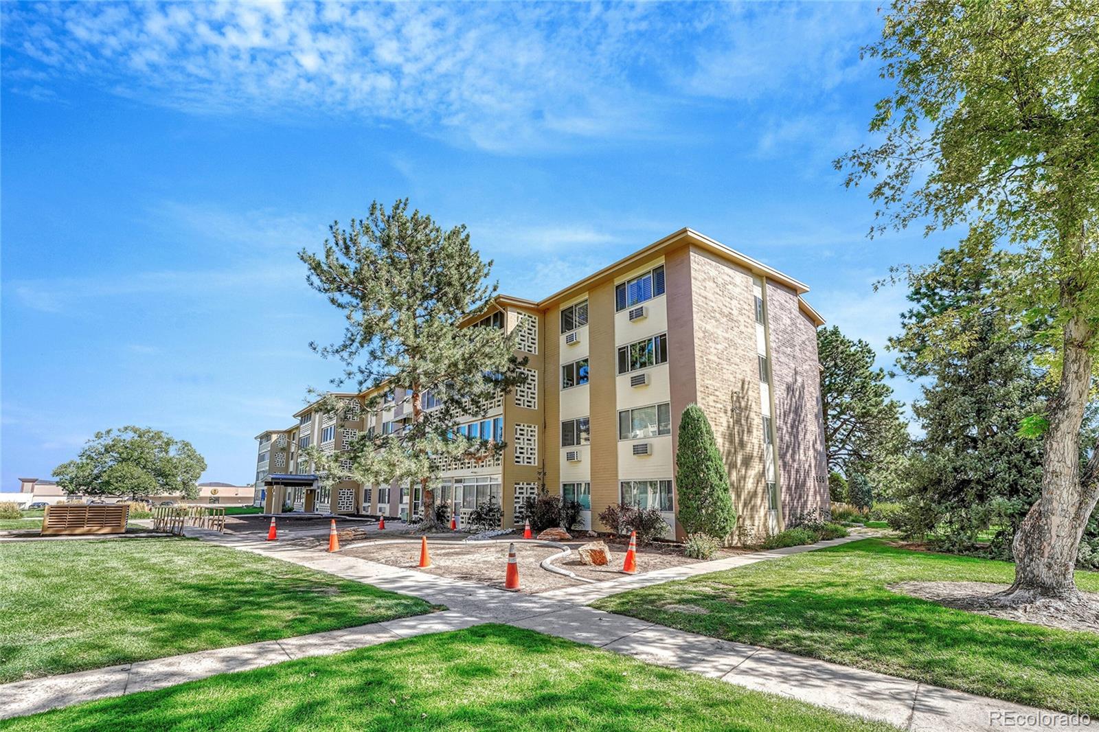 9655 Center Avenue, Unit 9D Denver, CO 80247 - Photo 14 of 21 a view of a building with a yard