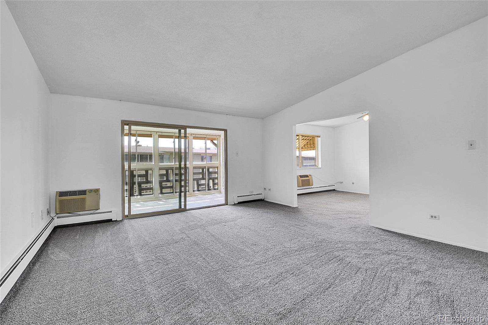 9655 Center Avenue, Unit 9D Denver, CO 80247 - Photo 15 of 21 an empty room with windows