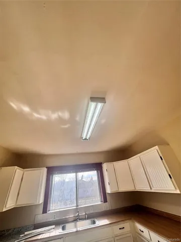 a view of room with window and cabinet