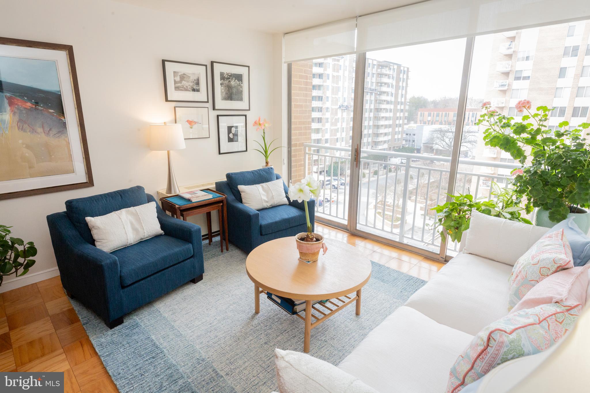 3001 Veazey Terrace Northwest, Unit 1128 Washington, DC 20008 - Photo 11 of 22 a living room with furniture and a large window