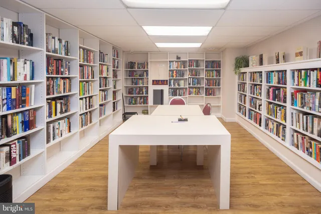 a view of a living room with a book shelf