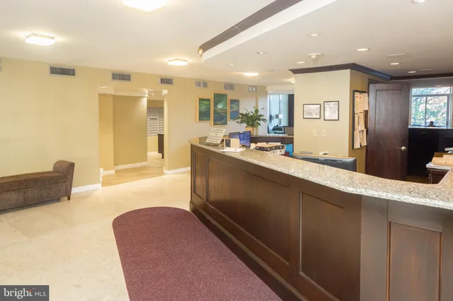 a large kitchen with kitchen island a sink stainless steel appliances and cabinets