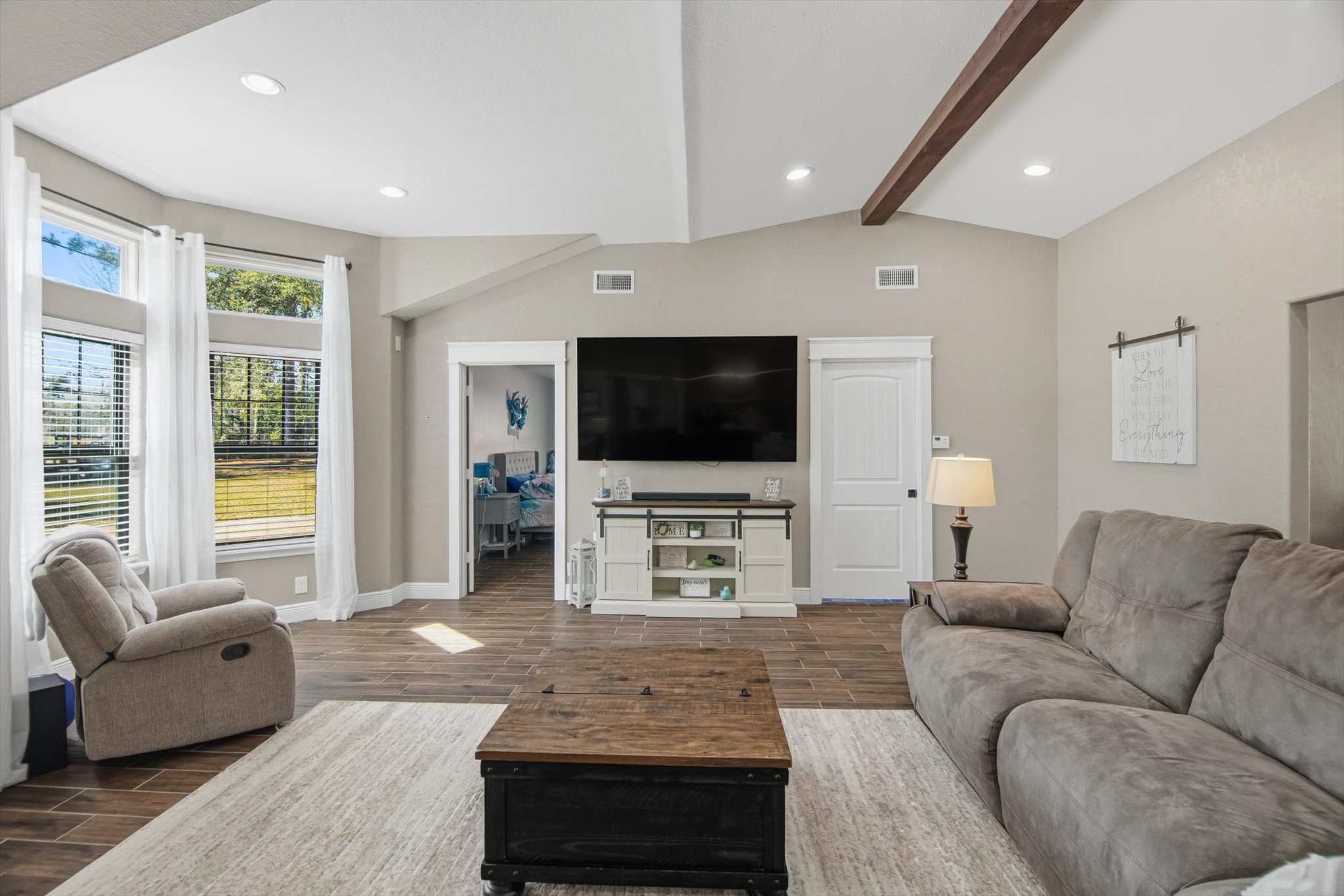 9711 Highway 150 Shepherd, TX 77371 - Photo 15 of 48 a living room with furniture and a flat screen tv
