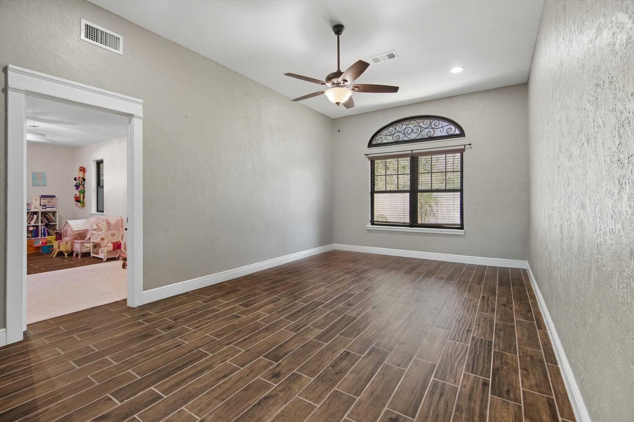 9711 Highway 150 Shepherd, TX 77371 - Photo 22 of 48 wooden floor in an empty room with a window