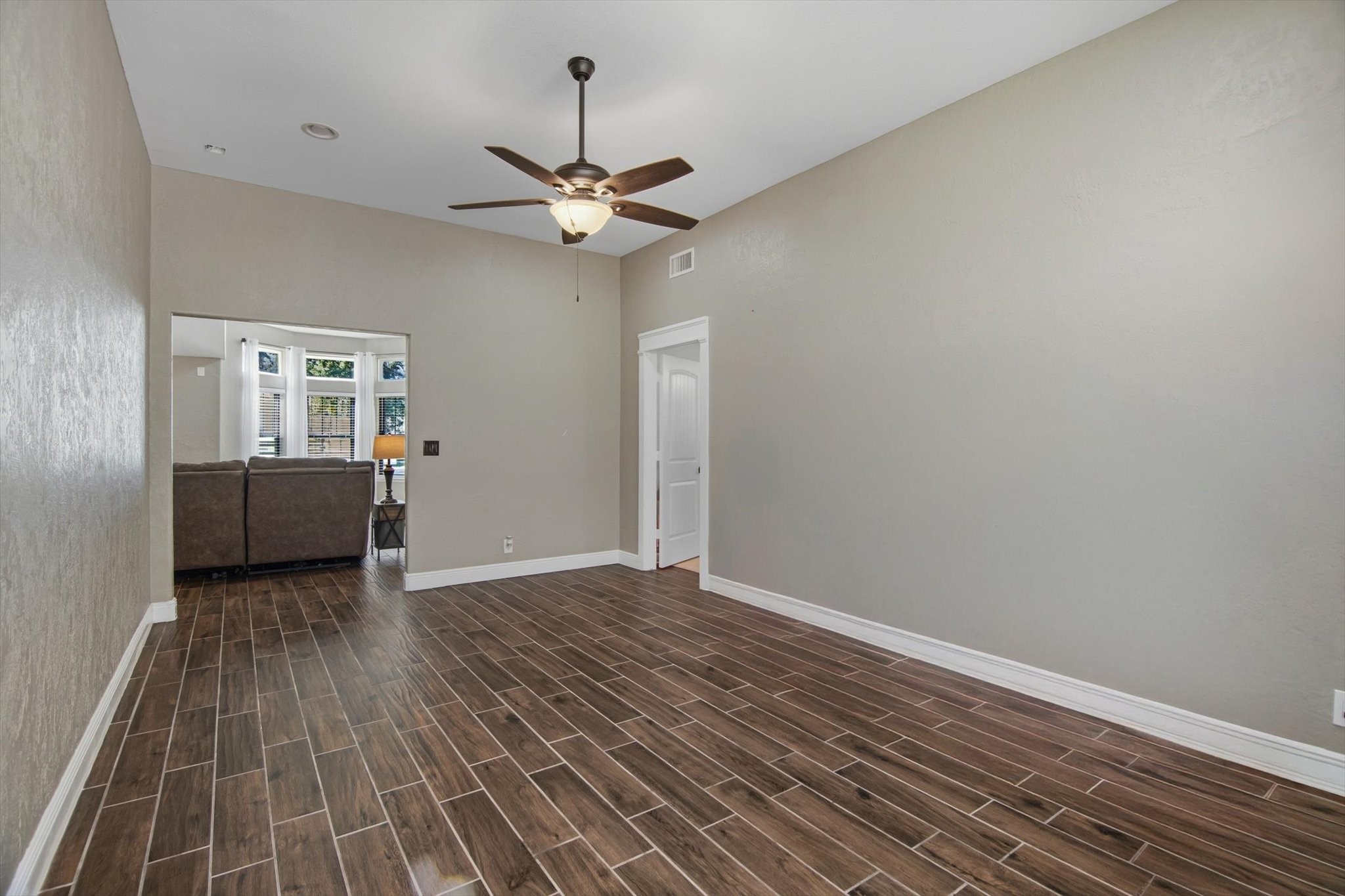 9711 Highway 150 Shepherd, TX 77371 - Photo 23 of 48 wooden floor in an empty room with a window