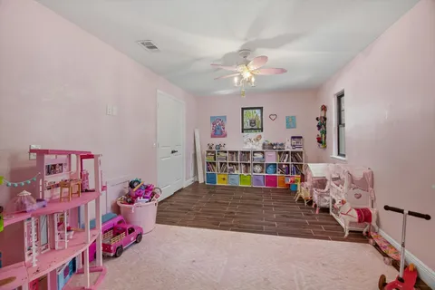 a bedroom with furniture and baby crib
