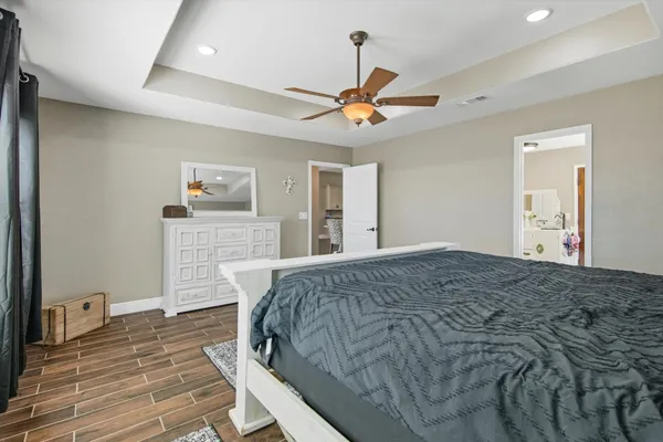 a bed room with a bed and a chandelier