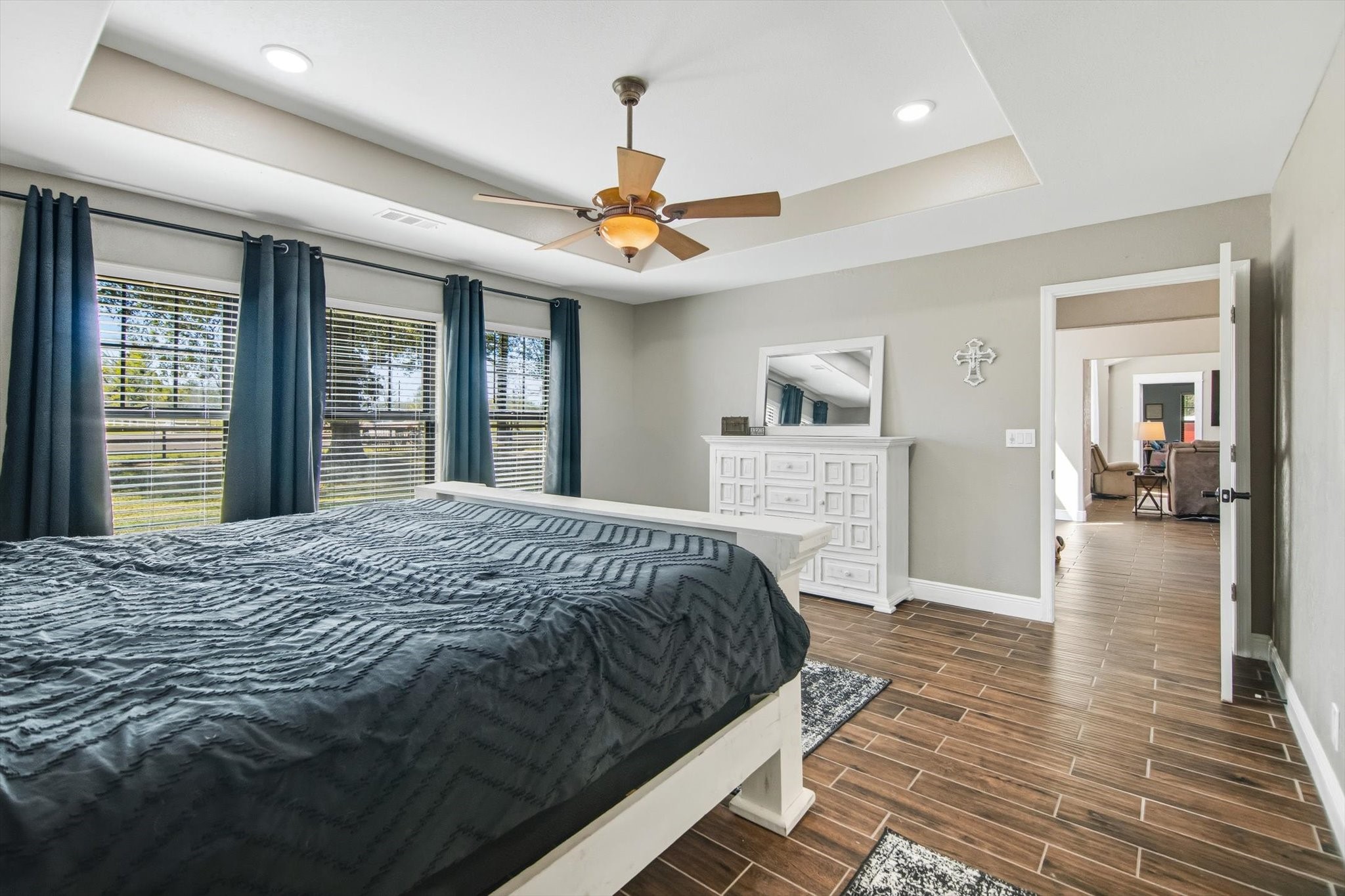9711 Highway 150 Shepherd, TX 77371 - Photo 29 of 48 a bedroom with a large bed chandelier and a window